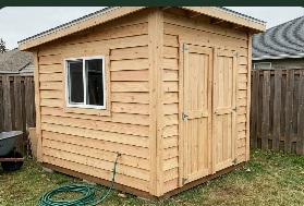 Natural wood shed with a window and double doors