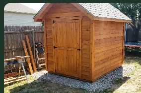 Wooden garden shed with a pitched roof